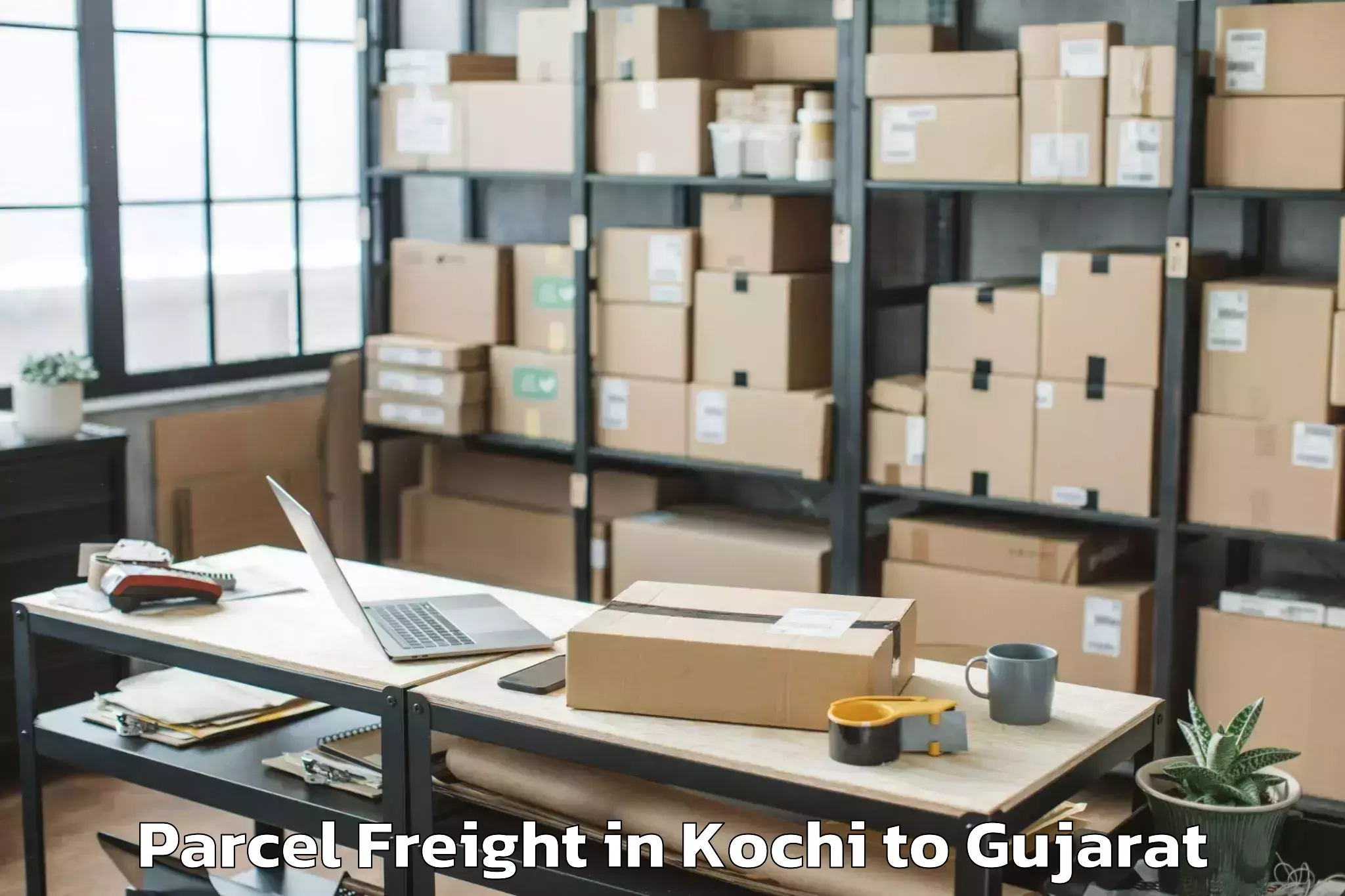 Book Kochi to Thasra Parcel Freight